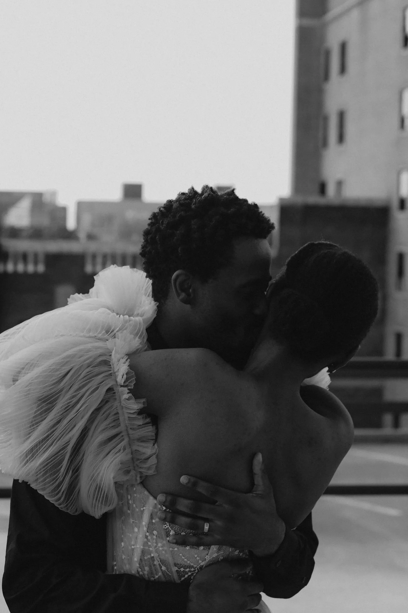 Couple embracing, black and white portrait
