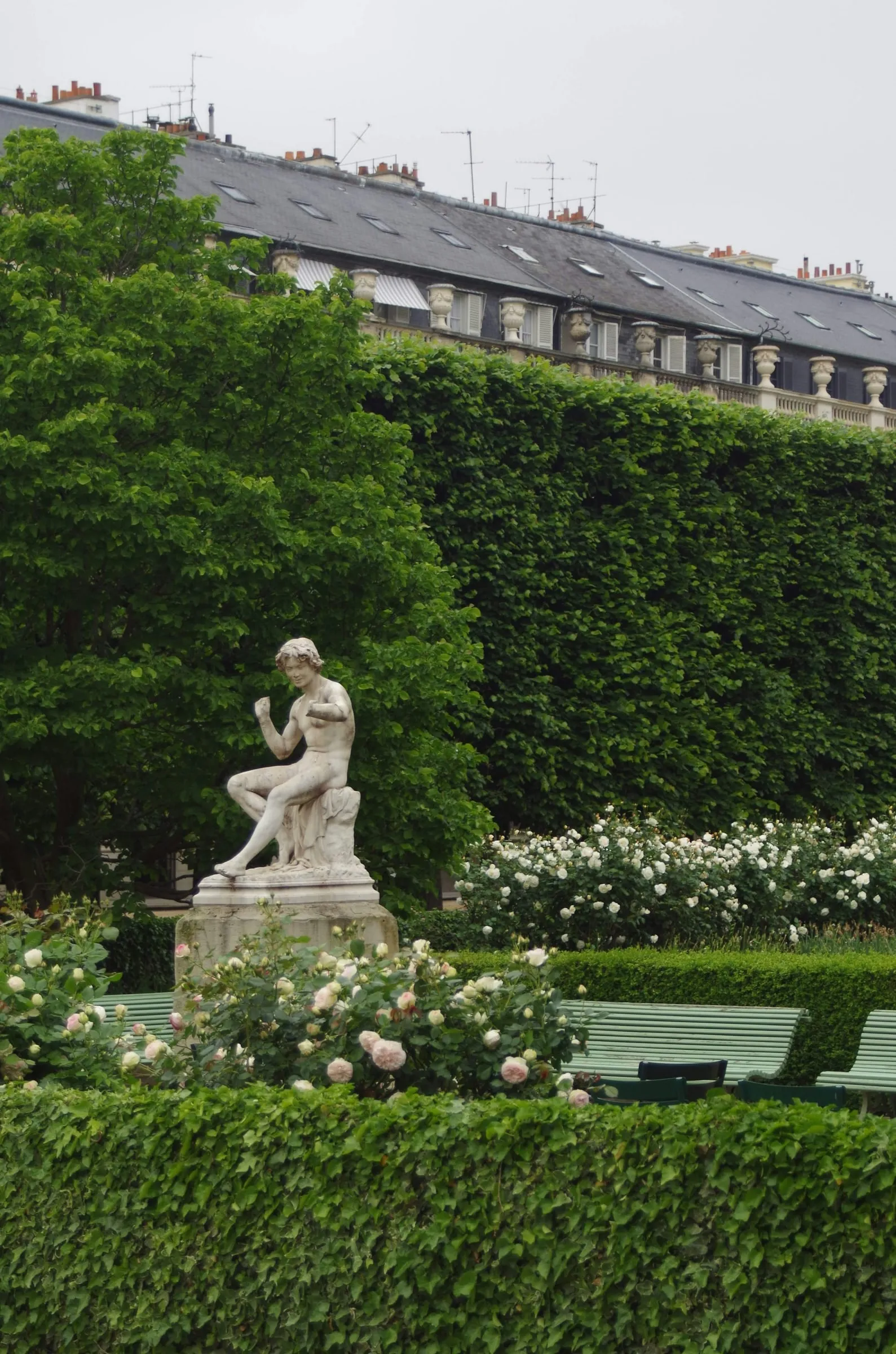 Marble statue in a Parisian palace garden