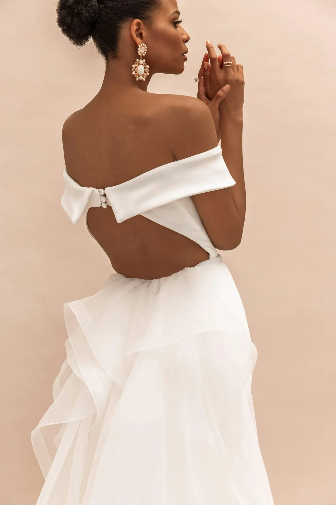 Off-the-shoulder gown seen from behind