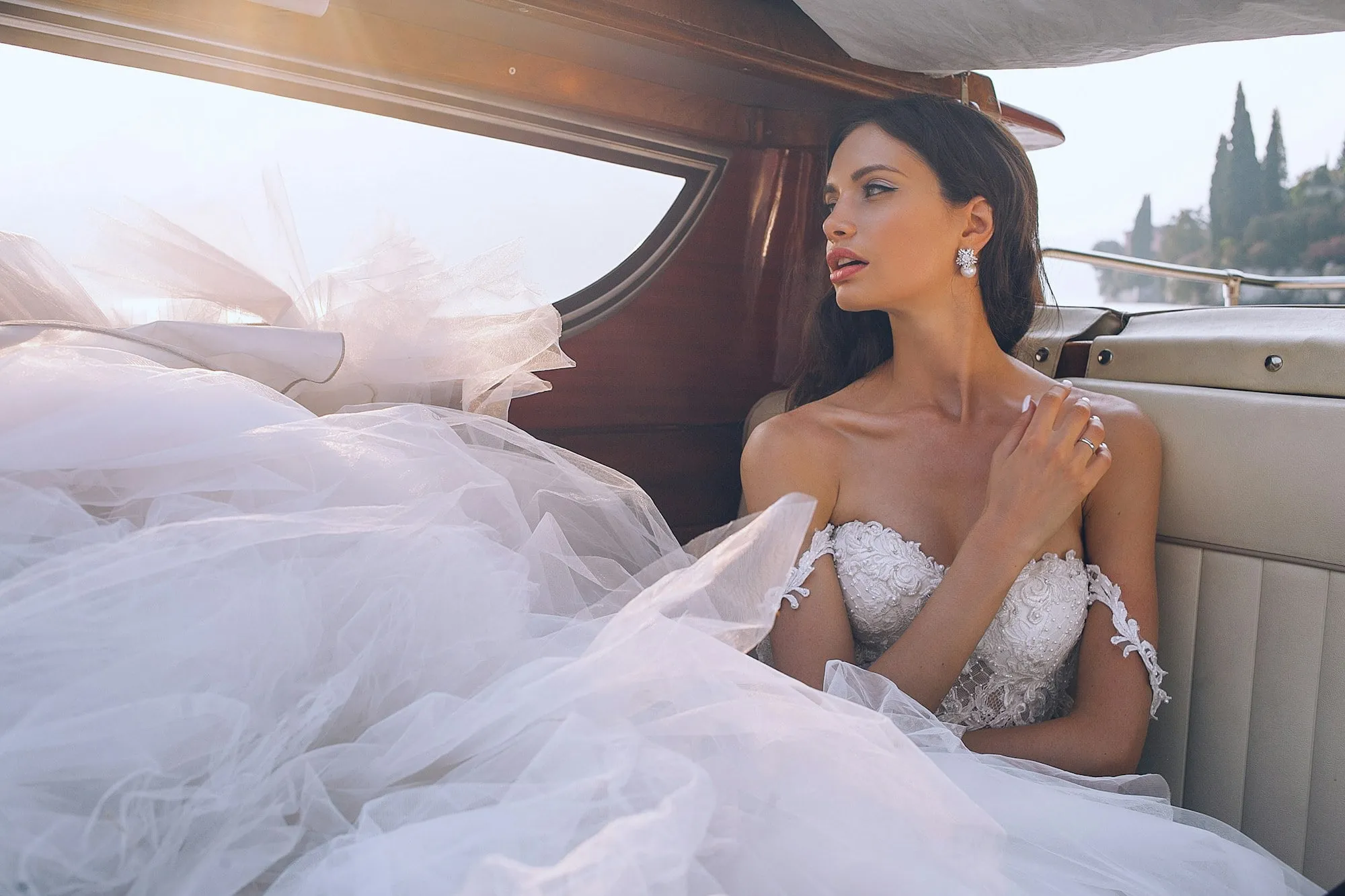 The bride in the back of a vintage car