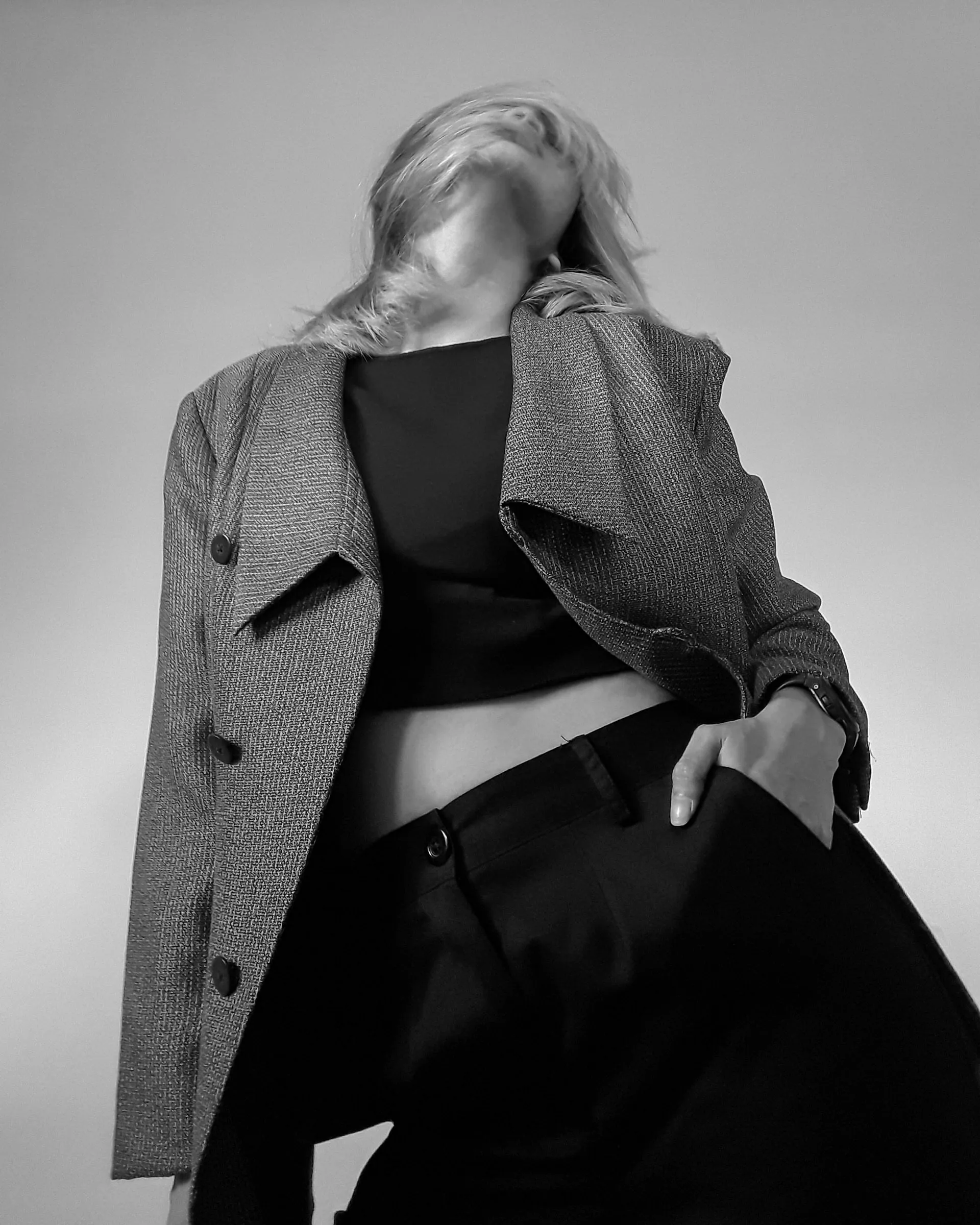 Model in an oversized jacket, black and white