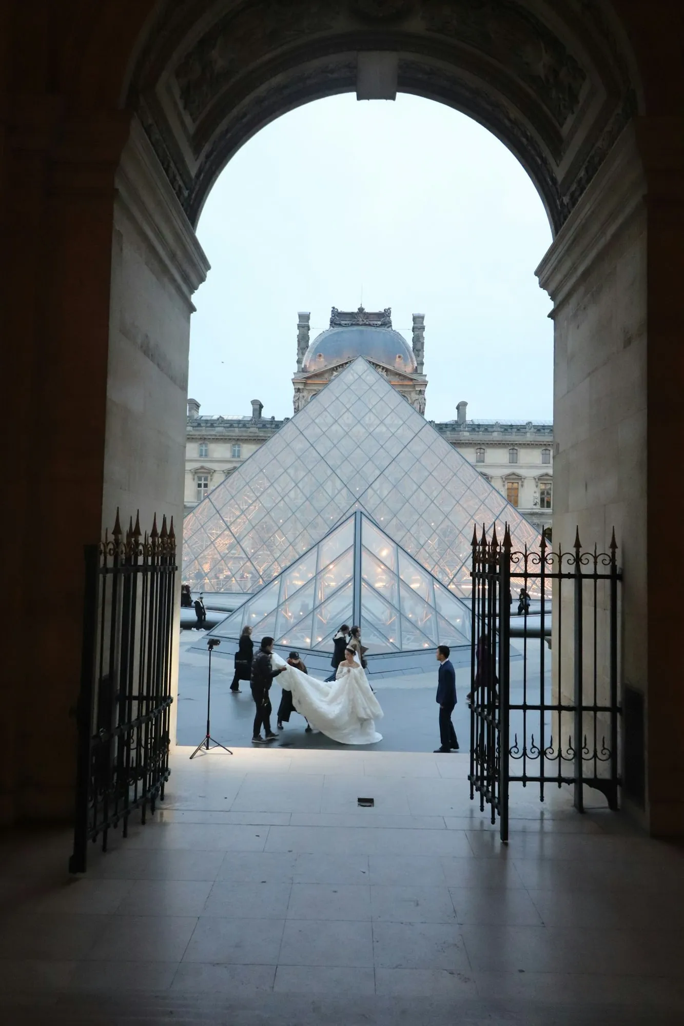 The Louvre pyramid seen through an arch