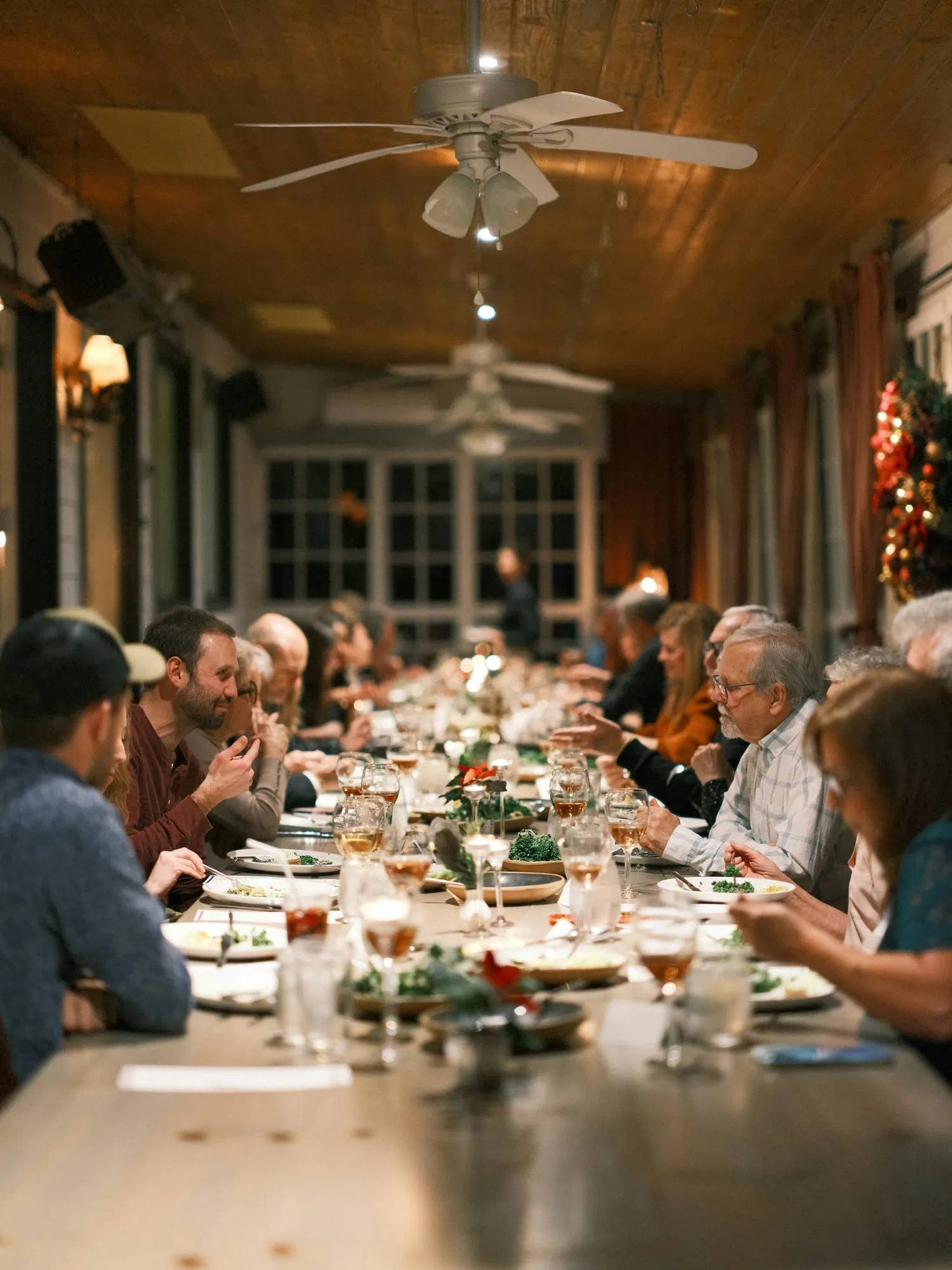 A long team table in a warm room
