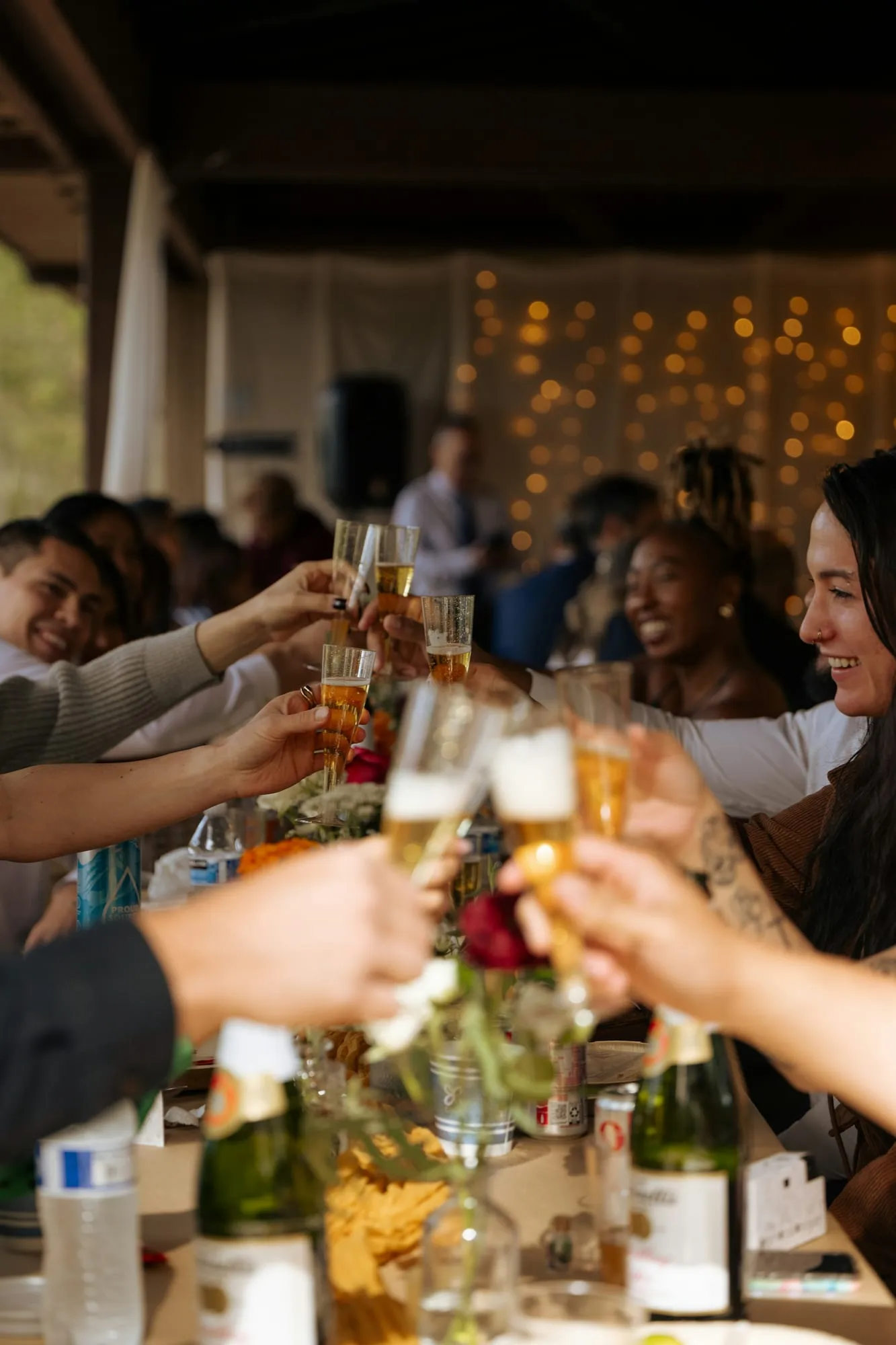 Champagne glasses raised at a party